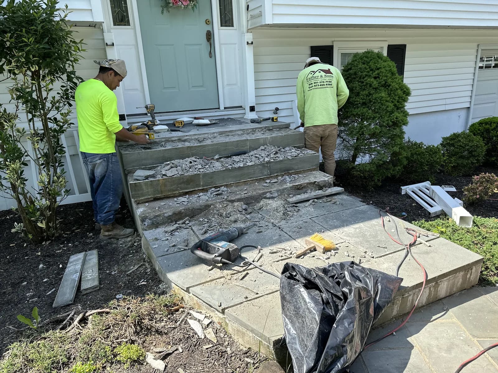 Bluestone front steps and landing installed over a concrete base in New Jersey