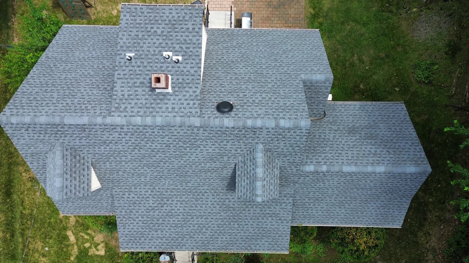 Aerial view of a newly shingled roof on a NJ residence